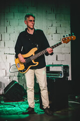 Obraz premium Bass and electric guitar music band artist have solo live performance on a stage. Repetition and practice