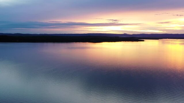 Wide aerial sunset panorama of Lake Macquarie in Australia on Pacific coast.
