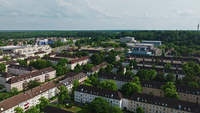 Drone shot of Wolfsburg city , Germany . It's known as the headquarters for Volkswagen and for the Autostadt, an automobile-themed park with a classic-car museum and driving track.