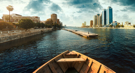 Egypt, Cairo - Boat POV Panoramic View of Nile River and Modern Skyscrapers, Buildings near Zamalek and Downtown Cairo, Sunset View.