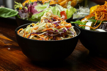 delicious coleslaw salad based on carrots, white cabbage and red cabbage