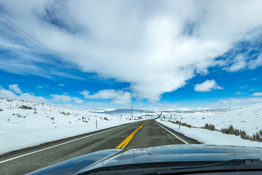 USA, Idaho, Bellevue, Highway through snow-covered landscape as seen from car