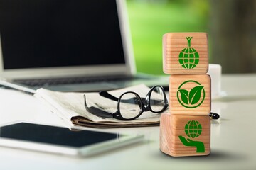 ESG concept, Businessman hand and wooden cube with icons