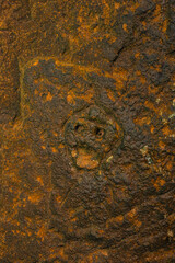 Rock texture hieroglyphs Taino art carved in the wall of the cave in Cueva del indio arecibo