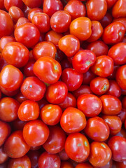 Cherry tomatoes background. Top view of fresh red cherry tomatoes.
