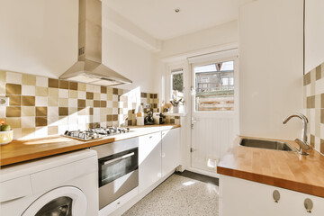 a kitchen area with a washer, stove and dishwasher on the counter in front of the sink