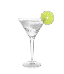 Martini glass of refreshing cocktail with lime and ice cubes isolated on white