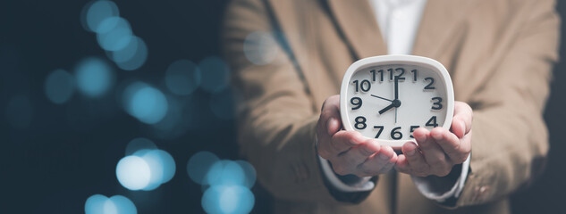 clock on businessman hand, time management concept ,effective business planning ,time management in...