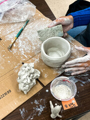Student working on pottery project.