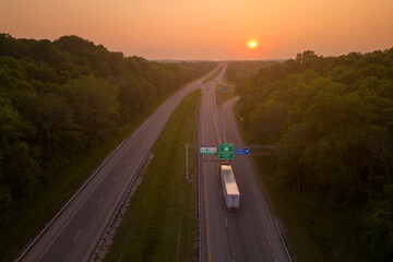 Illinois state board sign. sunset over the highway road 