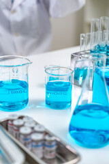 Chemical laboratory research with scientific tube and flask glassware equipment, science medicine liquid experiment test on Chemistry, Biotechnology, or Biology for business medicals development