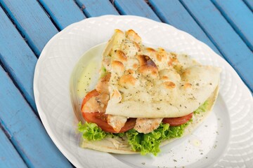 Fresh tasty sandwich with salad on plate