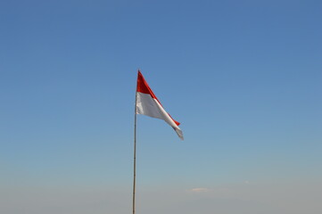 Fototapeta premium Indonesian Flag with the beautiful blue sky