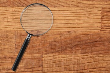 Classic Magnifying Glass on desk Background