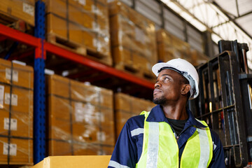 Portrait of smart good looking African - American Black warehouse staff - worker working in warehouse.