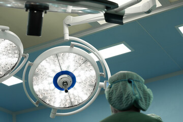 Surgery modern operating room with surgical lamp for emergency save lives.Medical team of surgeons...