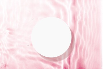 White empty round podium on a pink water