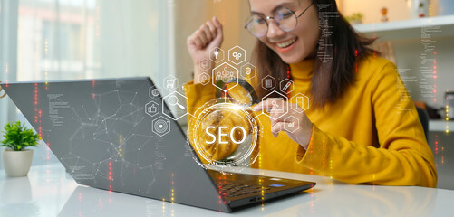 Search Engine Optimization (SEO). Woman using computer to analyze data statistics reports to...