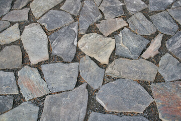 natural rough paving stones on ground