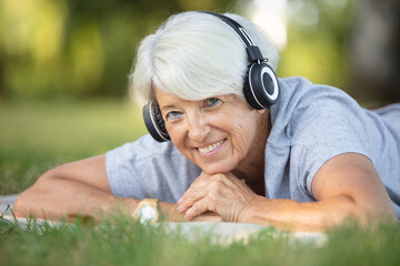 portrait of happy senior woman with earphones