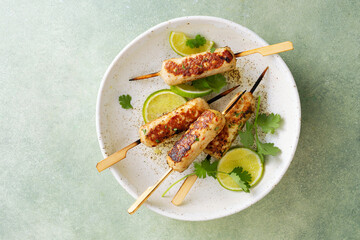 Chicken kebab on skewers with lime
