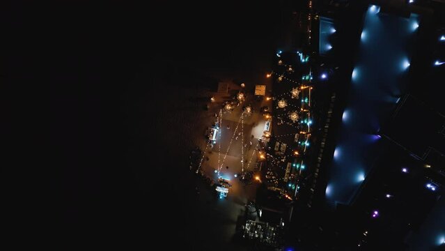 Top view of a night party on the beach