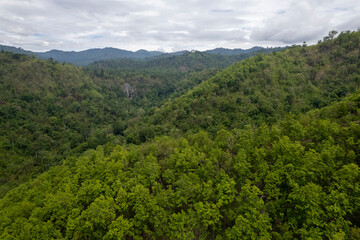 Top view Landscape of Morning Mist with Mountain Layer at north of Thailand. mountain ridge and clouds in rural jungle bush forest
