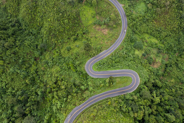 Top view Landscape of Morning Mist with Mountain Layer at north of Thailand. mountain ridge and clouds in rural jungle bush forest