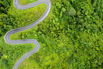Top view Landscape of Morning Mist with Mountain Layer at north of Thailand. mountain ridge and clouds in rural jungle bush forest