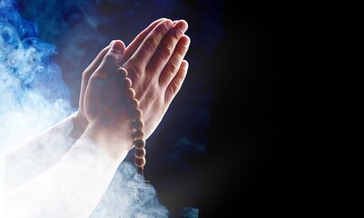 Fototapeta na wymiar Muslim man hands praying with wood rosary beads