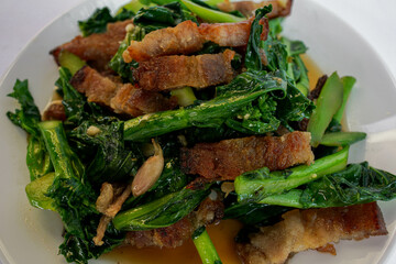 Stir Fried Kale with Crispy Pork Belly with white background food menu