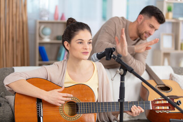 family singing and playing music at home