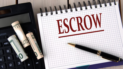 ESCROW - word in a notebook on the background of a calculator and banknotes