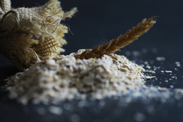 World grain crisis. A handful of cereals and on a dark background.