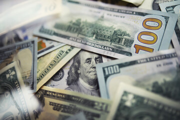 Group of money stack of 100 US dollars banknotes a lot of the background texture. Cash money in a large pile as a finance background.