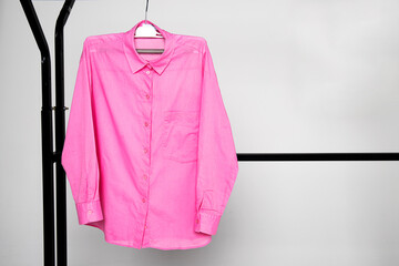pink shirt on hangers