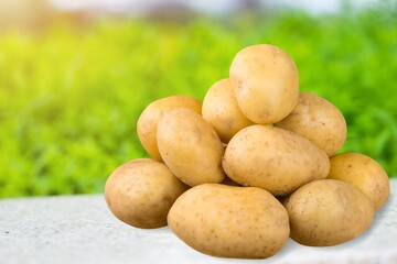 Young fresh ripe potatoes on desk
