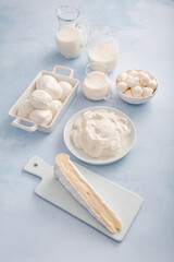 Assortment of milk products - buttermilk, kefir, yogurt with probiotics, ayran, cheese,  mozzarella, quark and cream.