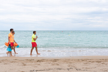 Three Lifeguards on a empty the beach