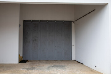 facade large slide garage sectional gray wooden home door grey building