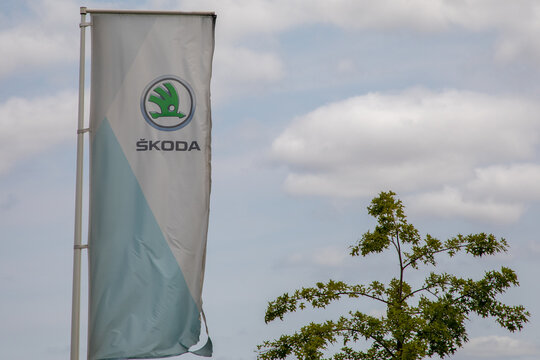 skoda store dealership sign and text logo on flag of car store Czech automobile manufacturer shop