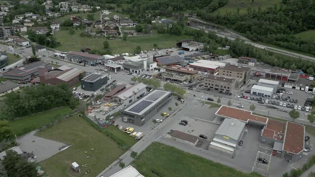 Industrial zone of a small town in the mountains. Brig Glis in Switzerland. Aerial Shot