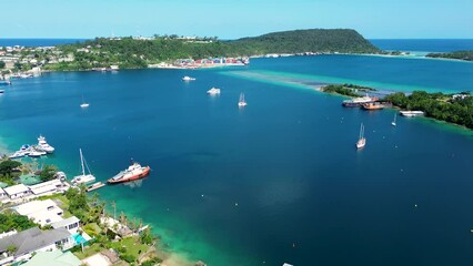 Aerial drone shot of Port Vila wharf bay dock with sail boats yachts ship Ifira Island travel tourism holiday destination Pacific Islands Vanuatu 4K