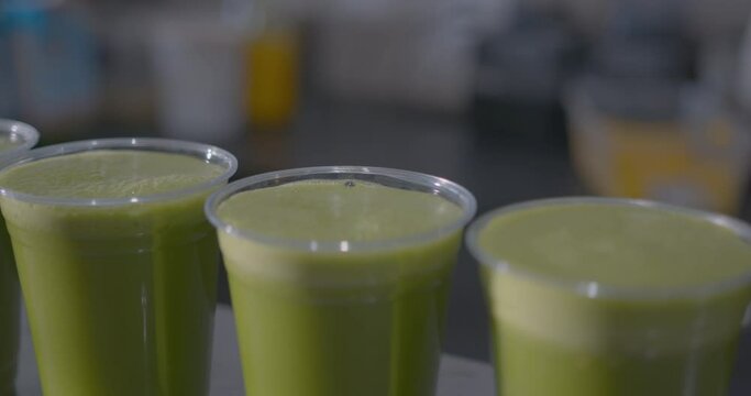 Close Up High Angle of a Row of Green Juices