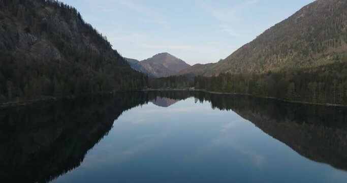 Flying Above Calm Lake Water With Mirror Reflection of Hills of Alps, Langbathseen, Upper Austria
