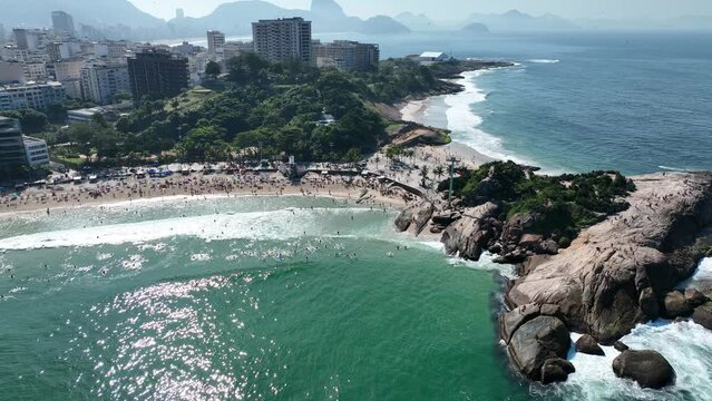 Aerial view of Diabo beach and Ipanema beach, Pedra do Arpoador. People sunbathing and playing on the beach, sea sports. Rio de Janeiro. Brazil