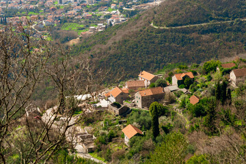 Fototapeta na wymiar View of the village of Gorn Lastva from the mountain hiking trail above Tivat.