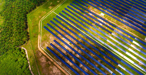 Aerial view over Solar cells energy farm in countryside landscape. Solar panels in aerial view,...