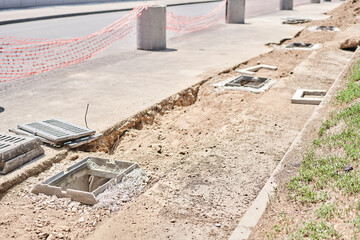 Laying concrete manholes and drain pipes for stormwater system. Connecting a trench drain to a...
