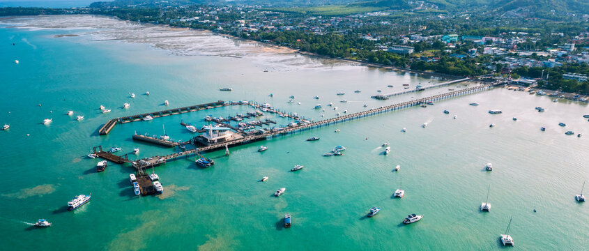 Chalong pier phuket in aerial view. Seascape at yacht club with sailboats.